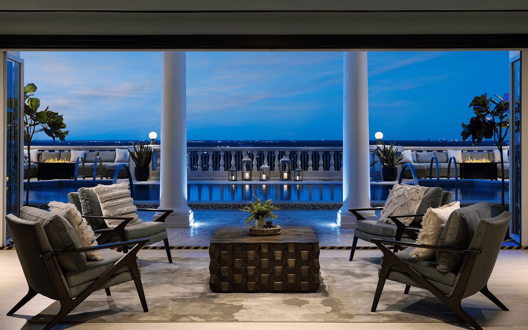 outdoor seating area overlooking the pool